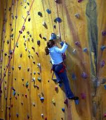 A rock climbing wall in a gym